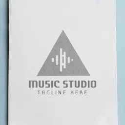 Sleek Triangular Music Studio Mockup Displaying Sound Waves Logo Template